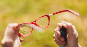 Apply a small drop of lotion-free dishwashing liquid to each lens