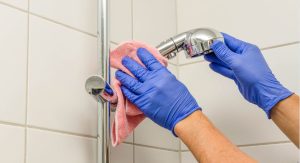 Scrub and Rinse the Shower Head